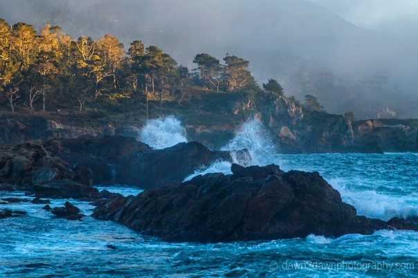 The sun sets on the rocky landscape at Point Lobos State Natural Reserve in Carmel, California